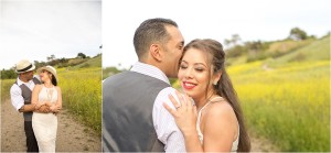 engaged couple takes photos in wildflower field in Palos Verdes, Ca