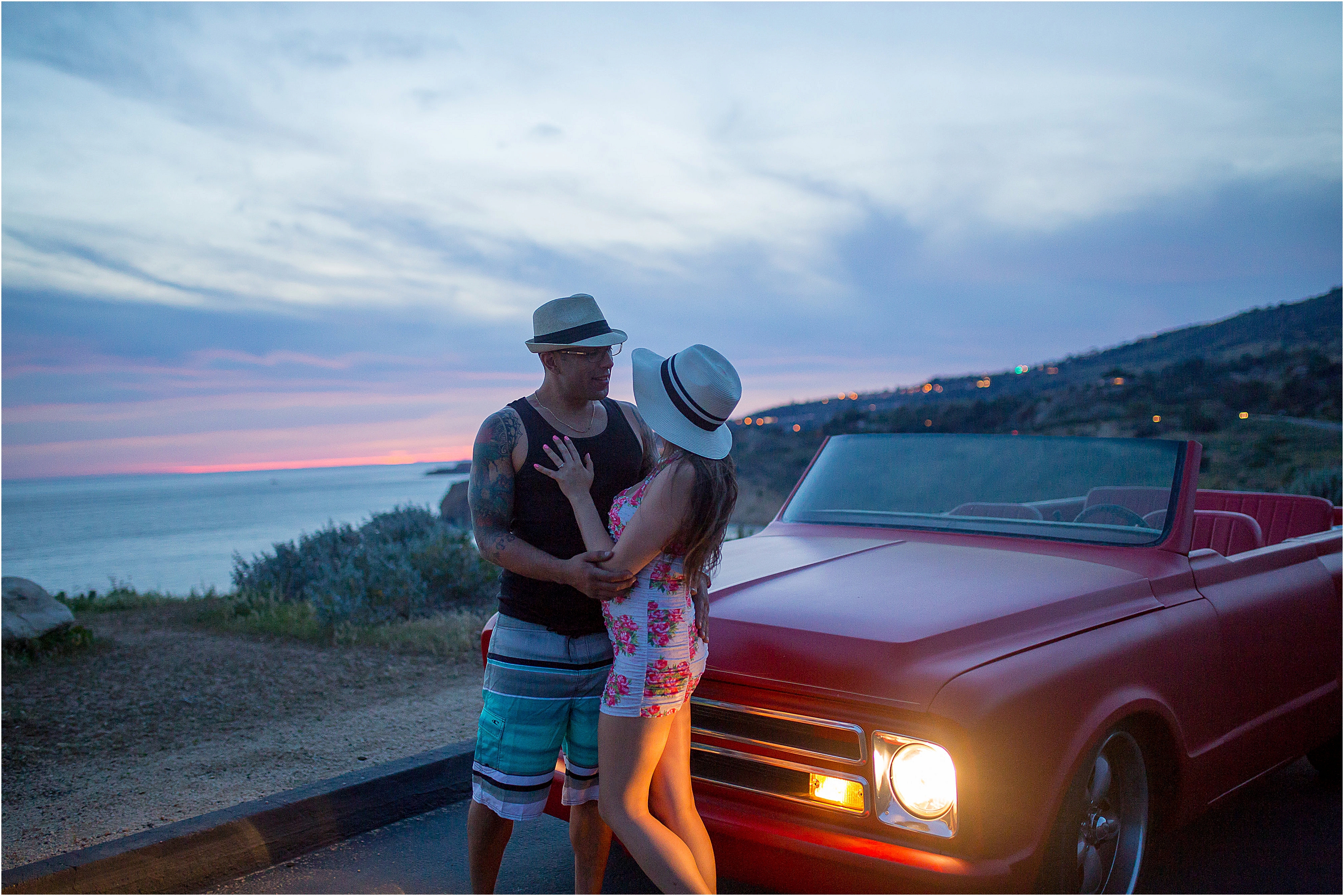 Couple poses in front of Chevy blazer for photos at dusk in palos verdes, ca.