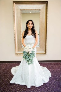 stunning bridal portrait in front of large mirror