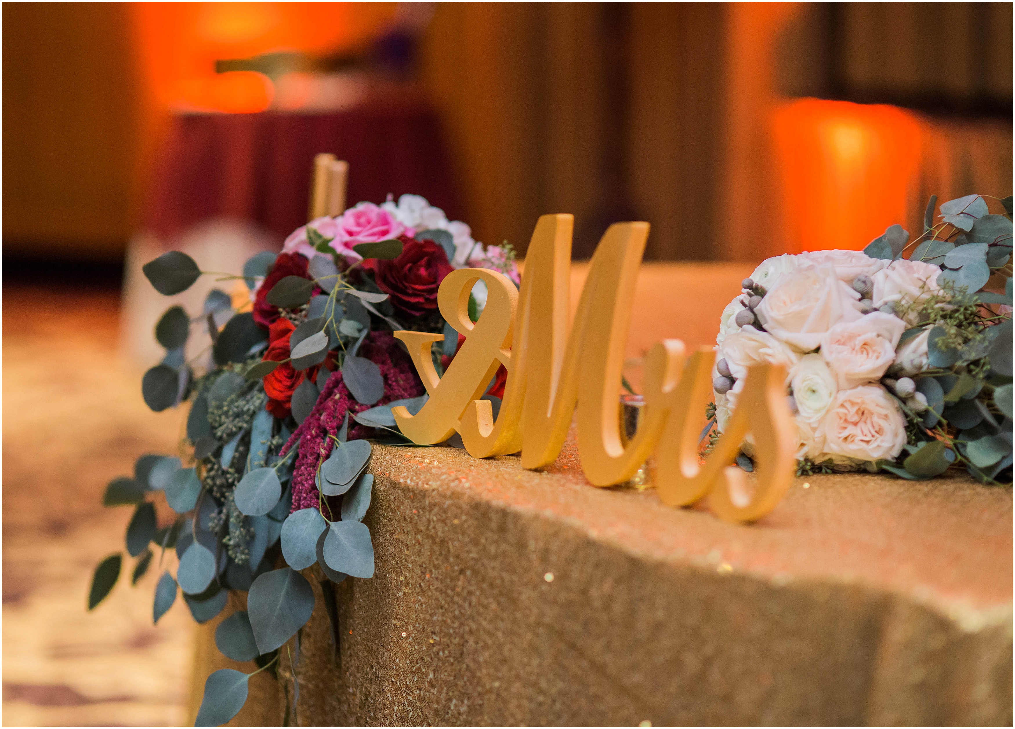 gold wedding sign with deep pink flowers