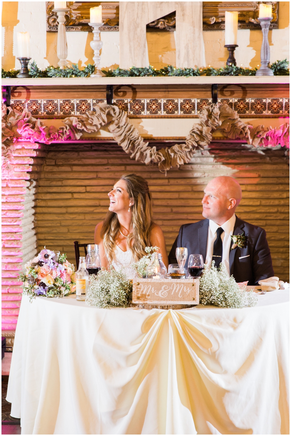 Rustic decor for sweetheart table- bride and groom during toast