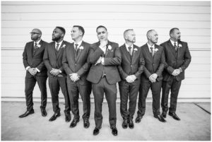 groomsman pose in front of wood wall, black and white groomsmen, #sanpedrowedding, #coastalwedding, #southerncaliforniawedding, #southerncaliforniaweddingphotographer, #michaelstuscanyroomwedding, #blushandgoldwedding, #mauvewedding, #losangelesweddingideas, #palosverdeswedding, #rainydaywedding, #2019weddingideas, #torranceweddingideas, #bridaldetails, #groomsdetails, #blushweddingdetails, #classicweddingideas