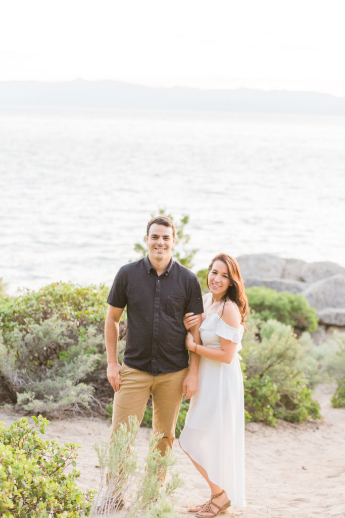 lake tahoe couple smiling for engagement photos