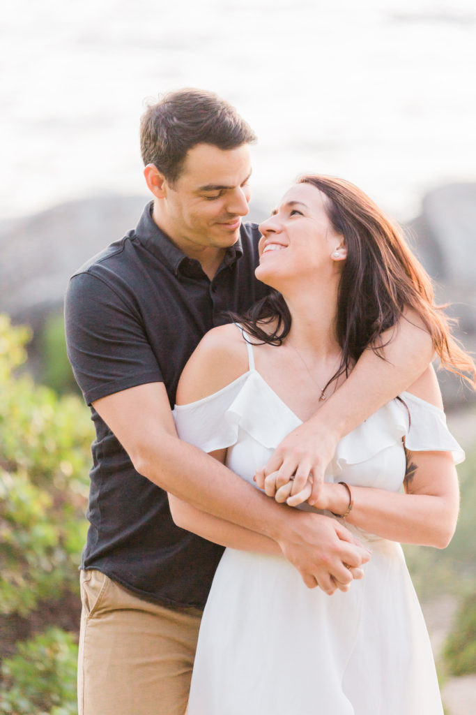 Lake Tahoe engagement photos of couple cuddling in each others arms
