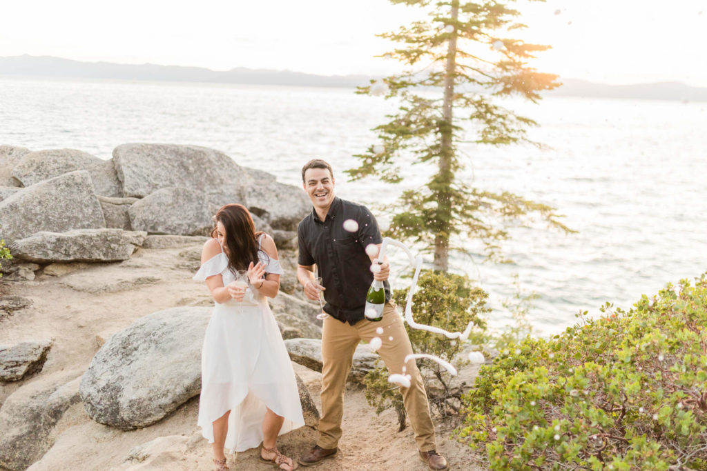 Chimney beach engagement photos with champagne pop