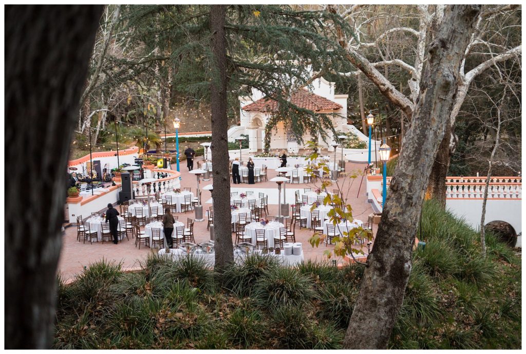 reception space at rancho las lomas with round tables and bistro lights