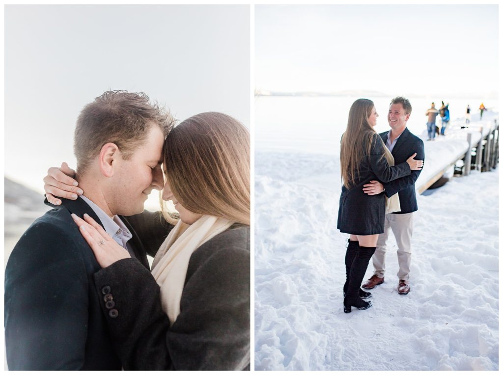 couple celebrating their proposal on snowy beach