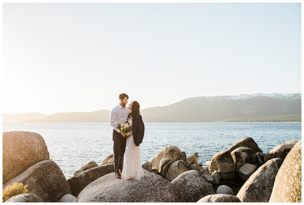 bride wearing grooms coat for wedding photos in lake tahoe