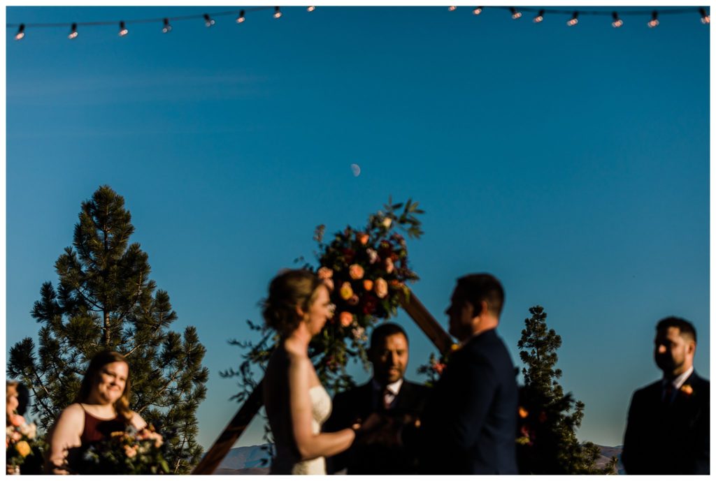 moon over couple during wedding ceremony