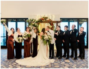wedding party photos in black suits and women in velvet dresses at the lake tahoe hyatt
