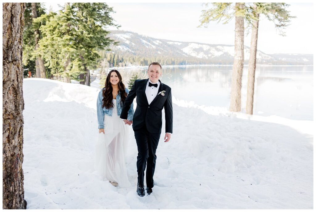 couple walking through the snow at lake tahoe cabin