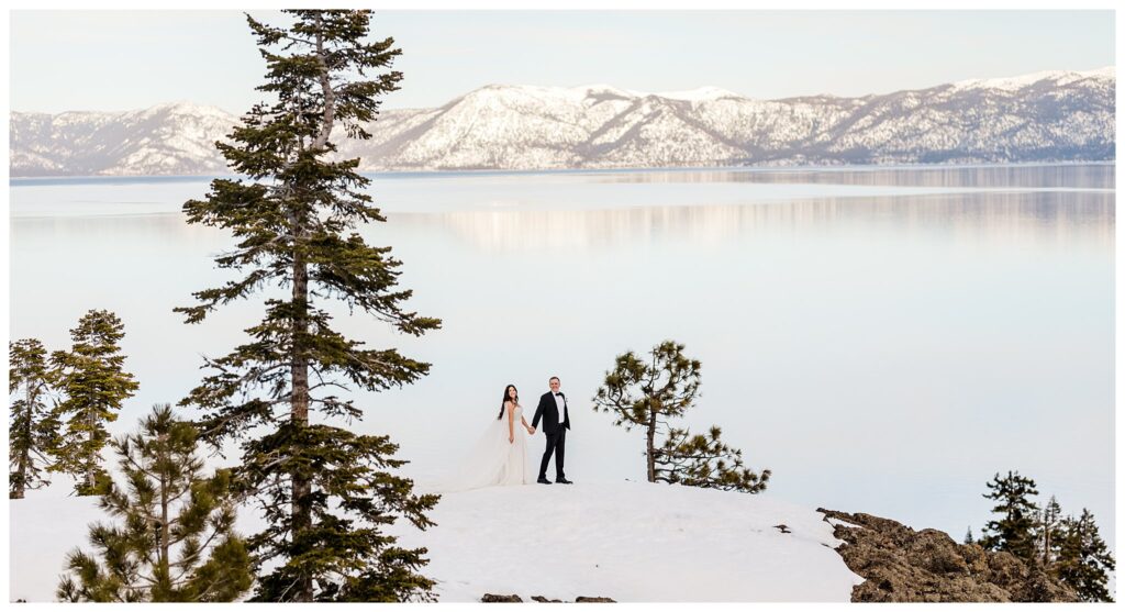 groom leading bride through the snow in lake tahoe