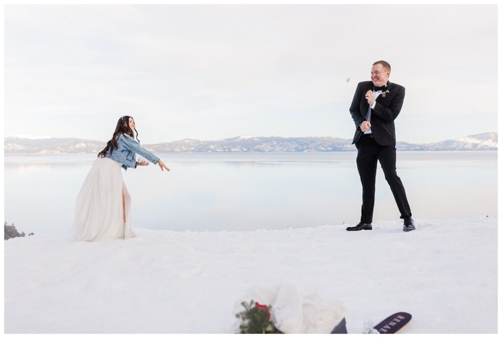 bride throwing snowball at her groom in lake tahoe