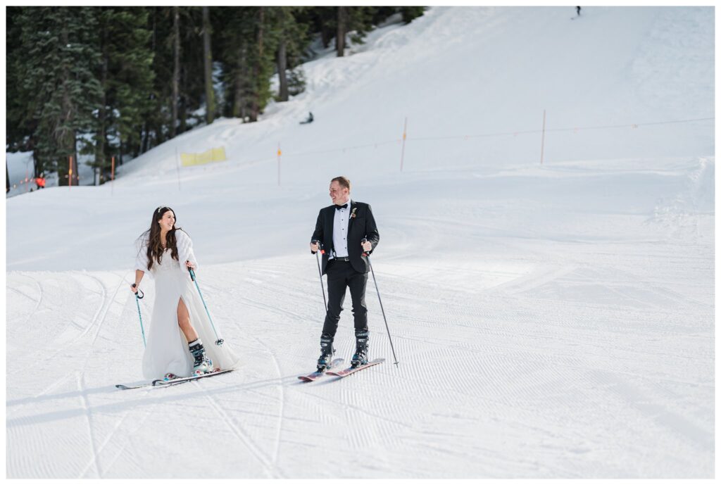 lake tahoe couple skiing in wedding clothes at homewood resort