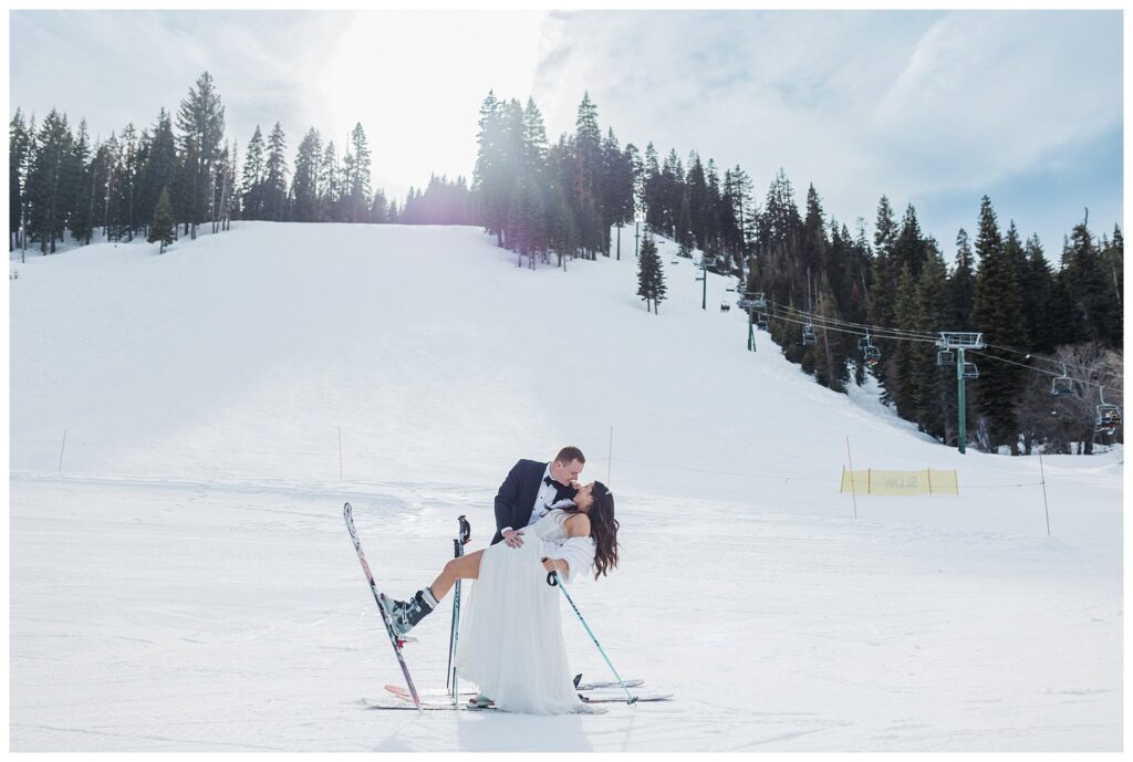 bride and groom skiing in wedding clothes at homewood resort in lake tahoe