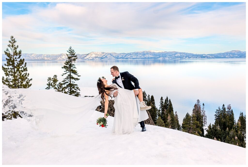wedding couple dipping for photo in the snow at lake tahoe